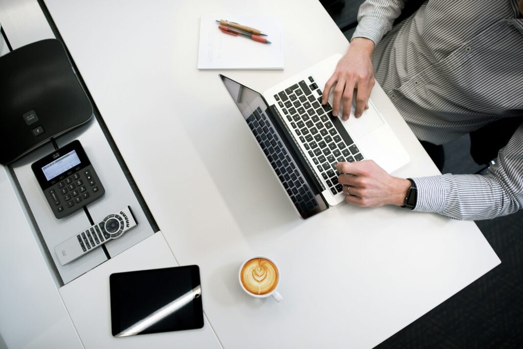 A person is working at a tidy desk