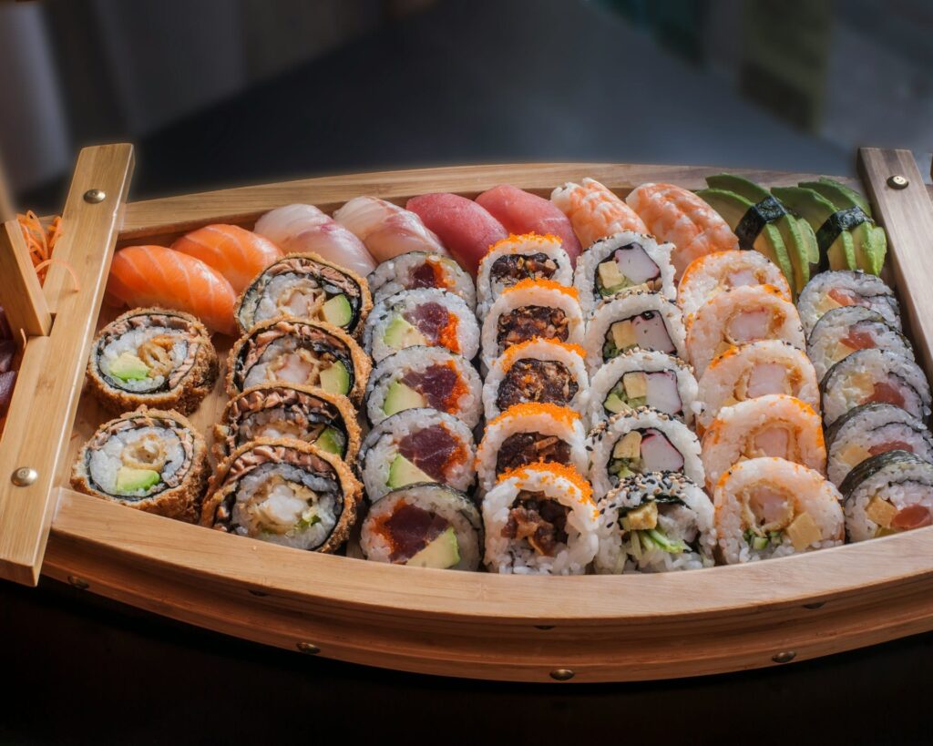 Delicious sushi is arranged in a wooden container