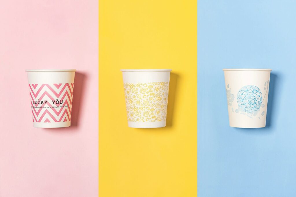 Disposable paper cups with a variety of printed designs