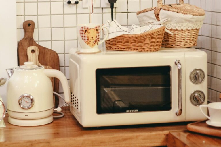 A microwave placed on a clean, organized tabletop